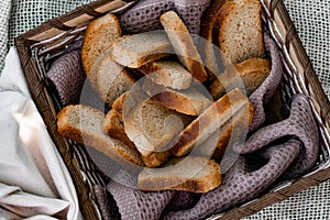 Vanilla crackers for tea, simple sweet crunchy snack in a wicker basket on natural fabric