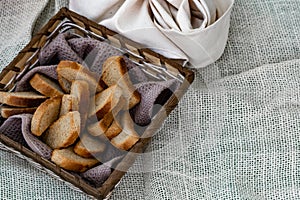 Vanilla crackers for tea, simple sweet crunchy snack in a wicker basket on natural fabric