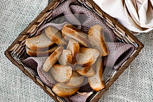 Vanilla crackers for tea, simple sweet crunchy snack in a wicker basket on natural fabric