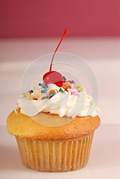 Vanilla cupcake with buttercream frosting photo