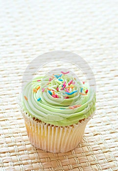 Vanilla cupcake with green lime icing