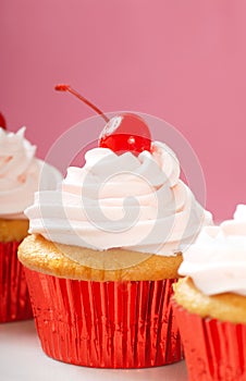 Vanilla cupcake with maraschino frosting