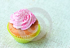 Vanilla cupcake with strawberry icing