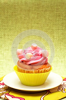 Vanilla cupcake with strawberry icing