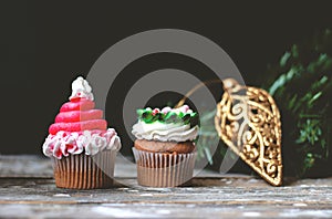 Vanilla cupcakes with christmas decoration ; holiday background