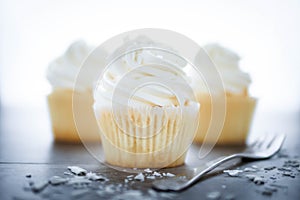 Vanilla cupcakes frosting with butter cream.