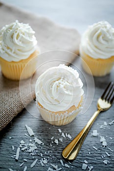 Vanilla cupcakes frosting with butter cream.