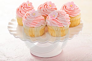 Vanilla cupcakes with pink raspberry frosting