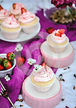 Vanilla  cupcakes with strawberry  icing photo