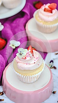 Vanilla  cupcakes with strawberry  icing closeup