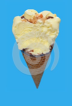 vanilla flaovr ice cream cone with a big bite on a blue background