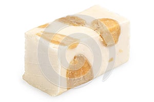 Vanilla flavored almond and pistachio white nougat isolated on white