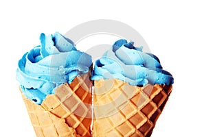 Vanilla frozen yogurt or colorful soft ice cream in waffle cone