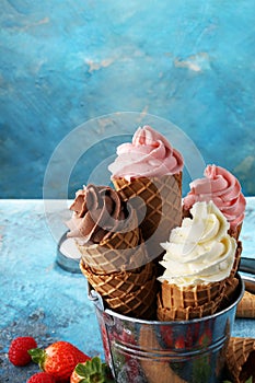 Vanilla frozen yogurt or soft ice cream in waffle cone.