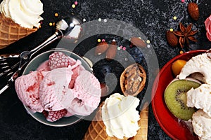 Vanilla frozen yogurt or soft ice cream in waffle cone in various flavour