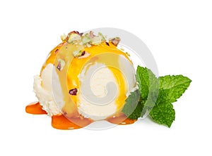 Vanilla ice cream ball with caramel syrup, nuts and fresh mint