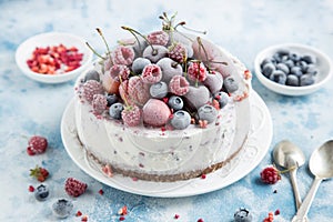 Vanilla ice cream cake with frozen berries