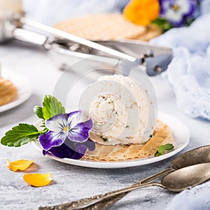 Vanilla ice cream with edible flowers