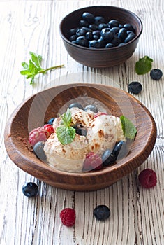 Vanilla ice cream with fresh berries