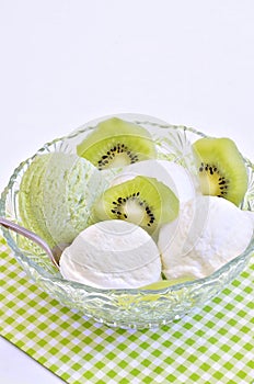 Vanilla ice cream and Kiwi ice cream with sliced Kiwi fruit