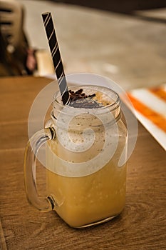 Vanilla ice cream milkshake drink in a glass jar