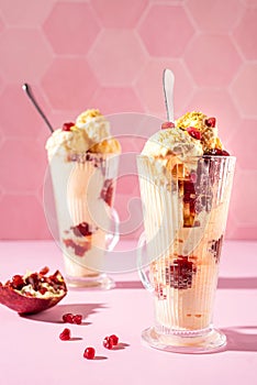 Vanilla ice cream milkshake garnished with fresh pistachio and pomegranate seeds