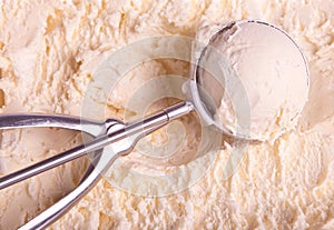 Vanilla ice cream and scoop