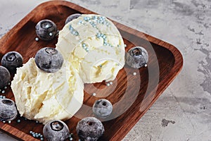 Vanilla Ice Cream Scoop Served on Wooden Plate