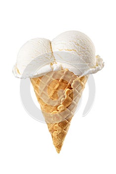 Vanilla ice cream scoops served on a waffle cone isolated on white