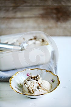 Vanilla ice cream with truffles, homemade in a rustic bowl