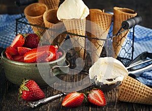 Vanilla Ice Cream in a waffle cones with strawberries