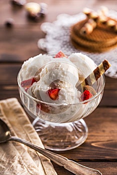 Vanilla ice cream with waffle in ramekin