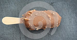Vanilla milk chocolate almond bar ice cream on black background