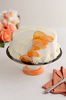 Vanilla orange cake with white frosting