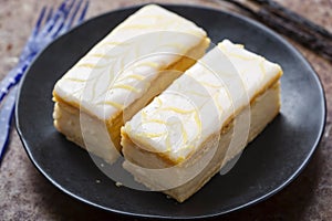 Vanilla slices. Puff pastry filled with vanilla custard topped with fondant icing.