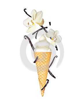 Vanilla soft serve ice cream with vanilla sticks and flowers in wafer cone close-up, isolated on white background