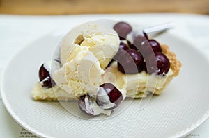 Vanilla tart with fresh cherries