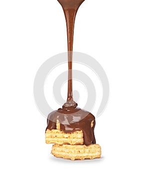 On vanilla wafer pouring chocolate