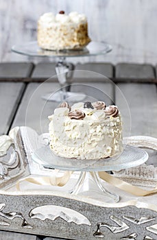 Vanilla wedding cake on cake stand