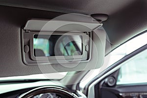 Vanity mirror in modern car, selective focus