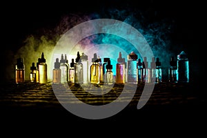 Vape concept. Smoke clouds and vape liquid bottles on dark background. Light effects. Useful as background or vape advertisement o