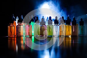 Vape concept. Smoke clouds and vape liquid bottles on dark background. Light effects. Useful as background or vape advertisement o