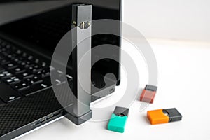 Vaping device charging with usb connection to laptop.