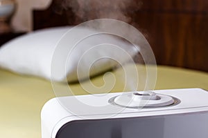 Vapor from humidifier in the bedroom. Ultrasonic humidifier in the house.