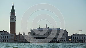 Vaporettos sailing near famous Doge's Palace in Venice, water tour, tourism