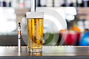 Vaporizer pipe and glass of beer photo
