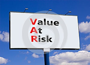 VAR Value at risk symbol. Concept words VAR Value at risk on beautiful big billboard. Beautiful blue sky cloud background.