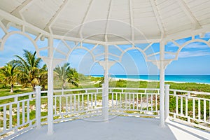 Varadero beach in Cuba seen from the windows of a white seaside wooden pavilion