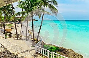 Nice inviting view of Melia Varadero beach and tender turquoise, tranquil ocean with people swimming, relaxing, on sunny ni