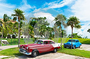 American Oldsmobile and a Buick vintage car parked in near the beach in Varadero Cuba - Serie Cuba Reportage